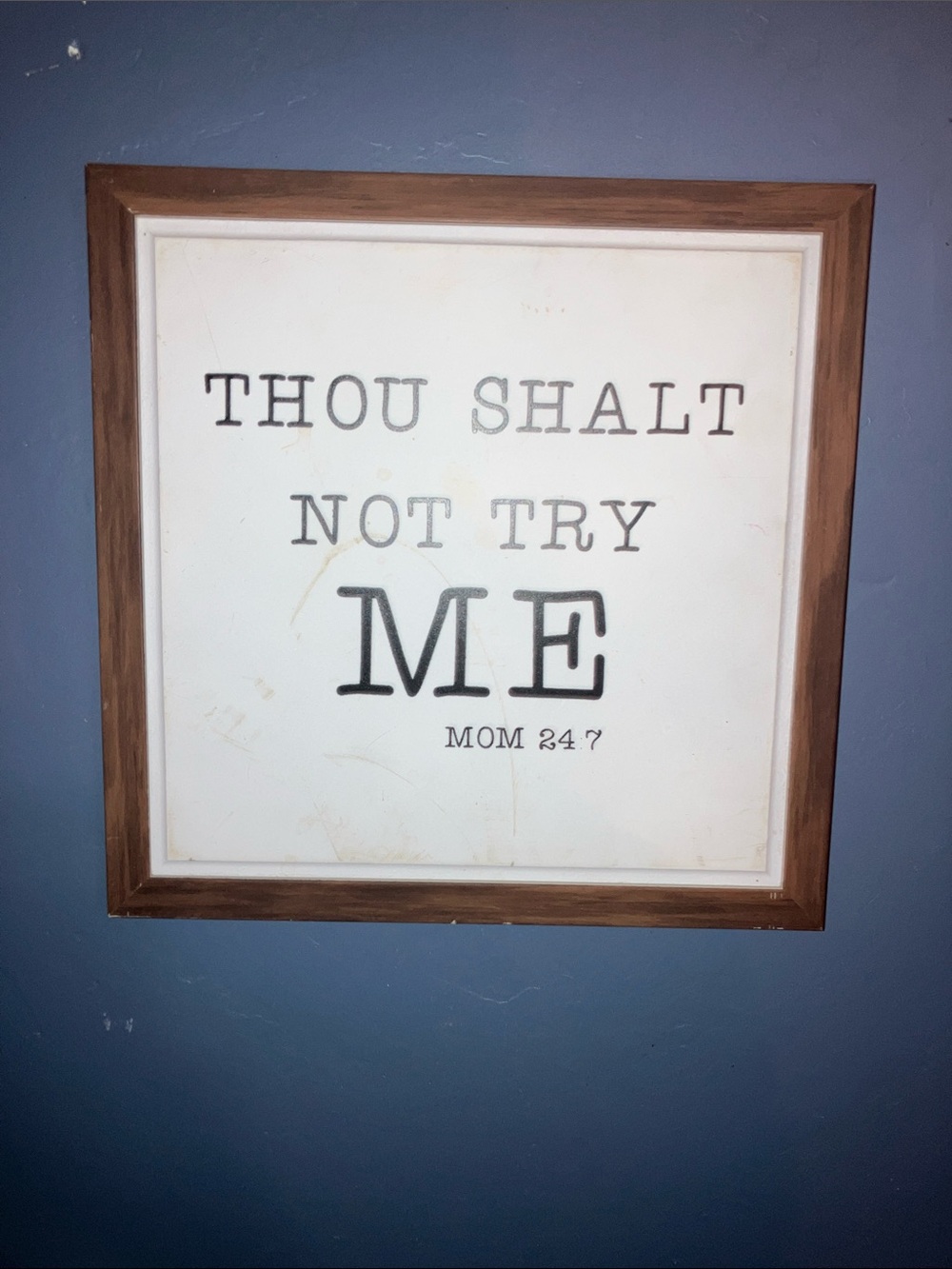 Source Unknown Framed Wall Art - Brown Frame, Black Text, White Background